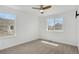Bedroom featuring natural light, neutral walls, and fan with light fixture at 20567 E Weaver Dr, Aurora, CO 80016