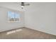 Well-lit bedroom with neutral carpeting, white walls, and ample natural light at 20567 E Weaver Dr, Aurora, CO 80016