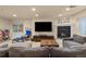 Finished basement featuring a fireplace, large tv, and cozy seating at 24702 E Ontario Dr, Aurora, CO 80016