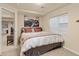 Cozy bedroom with neutral paint, carpet, and a window for natural light at 24702 E Ontario Dr, Aurora, CO 80016