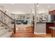 Open-concept living area with hardwood floors, seamlessly connecting the kitchen and the living room with a comfortable seating area at 24702 E Ontario Dr, Aurora, CO 80016