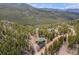 Sprawling forest landscape featuring a charming cabin retreat at 72 Rudi W Ln, Golden, CO 80403
