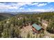 Picturesque cabin getaway with stunning views of rolling hills and mountain peaks in the distance at 72 Rudi W Ln, Golden, CO 80403
