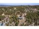 Panoramic view showcasing a cozy home nestled amongst lush green trees and a peaceful community at 72 Rudi W Ln, Golden, CO 80403