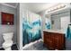 Cozy bathroom with blue mountain themed shower curtain and marble countertop at 72 Rudi W Ln, Golden, CO 80403