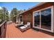 Relaxing deck with comfortable seating, a fire pit, and views of the mountains at 72 Rudi W Ln, Golden, CO 80403