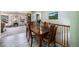 Dining area with wooden table and chairs, connecting to a cozy living room with carpet at 72 Rudi W Ln, Golden, CO 80403