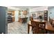 Open concept kitchen and dining room with wood table and floors with lots of natural light at 72 Rudi W Ln, Golden, CO 80403
