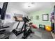 Well-equipped exercise room with treadmill, bike, weights, and motivational decor at 72 Rudi W Ln, Golden, CO 80403