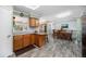 Open-concept kitchen with granite counters, leading to a cozy dining area and living space at 72 Rudi W Ln, Golden, CO 80403