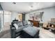 Welcoming living room with a cozy seating area, fireplace, and stylish sliding barn door at 72 Rudi W Ln, Golden, CO 80403