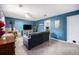 Cozy living room features a pellet stove, comfortable seating, and access to an exercise area at 72 Rudi W Ln, Golden, CO 80403