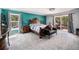 Spacious main bedroom showcasing a large bed, ensuite bathroom, and access to a private balcony at 72 Rudi W Ln, Golden, CO 80403