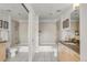 Bright bathroom with neutral tile, shower-tub combination and granite topped vanity at 1700 Bassett St # 1111, Denver, CO 80202
