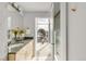 Bright bathroom featuring a granite countertop, wood cabinets, and city views at 1700 Bassett St # 1111, Denver, CO 80202