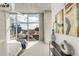 Bright bedroom with floor-to-ceiling windows and stunning city views at 1700 Bassett St # 1111, Denver, CO 80202