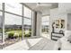 Bright bedroom with floor-to-ceiling windows and stunning city views at 1700 Bassett St # 1111, Denver, CO 80202