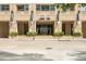 Street view of building entrance with manicured landscaping and covered entryway at 1700 Bassett St # 1111, Denver, CO 80202