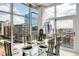 A modern dining room with large glass windows offering city views and ample natural light at 1700 Bassett St # 1111, Denver, CO 80202