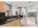 Bright kitchen featuring stainless steel appliances and hardwood flooring with open-concept floor plan at 1700 Bassett St # 1111, Denver, CO 80202