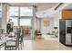 Open concept living space with exposed concrete, hard wood floors, and city views at 1700 Bassett St # 1111, Denver, CO 80202