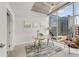Office space featuring floor-to-ceiling windows with cityscape views and neutral decor at 1700 Bassett St # 1111, Denver, CO 80202