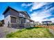 Beautiful backyard featuring a lush lawn, gravel accents, and a covered patio with great sky views at 960 S De Gaulle Ct, Aurora, CO 80018