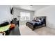Bright bedroom with a carpeted floor and natural light at 960 S De Gaulle Ct, Aurora, CO 80018