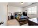Bright bedroom with a carpeted floor and natural light at 960 S De Gaulle Ct, Aurora, CO 80018
