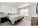 Bedroom with carpeted floors, a large window, and natural light at 960 S De Gaulle Ct, Aurora, CO 80018