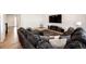 Cozy living room with a large sectional sofa, entertainment center, and modern decor for a relaxed atmosphere at 960 S De Gaulle Ct, Aurora, CO 80018