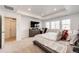 Main bedroom with carpet, recessed lighting, en suite bath, large window, and plenty of space for relaxing at 960 S De Gaulle Ct, Aurora, CO 80018