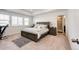 Large main bedroom with carpet flooring, natural light, and connecting bath, a restful retreat at 960 S De Gaulle Ct, Aurora, CO 80018