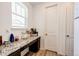 Pantry with granite counter, window, and door to storage, offering a functional space at 960 S De Gaulle Ct, Aurora, CO 80018