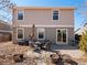 Charming backyard patio with stylish seating, an umbrella, and landscaping at 896 Willow Dr, Brighton, CO 80603