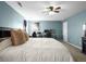 The bedroom boasts natural light, neutral tones and ample space at 896 Willow Dr, Brighton, CO 80603