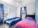 ' bedroom featuring fun car bed frame, stylish curtains, and ceiling fan at 896 Willow Dr, Brighton, CO 80603