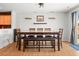 Inviting dining room featuring seating for six, stylish decor, and sliding doors to a patio at 896 Willow Dr, Brighton, CO 80603
