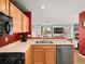 The open kitchen showcases stainless steel appliances and seamless transition into living spaces at 896 Willow Dr, Brighton, CO 80603