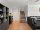 Welcoming entry area featuring hardwood floors, neutral walls, and staircase at 896 Willow Dr, Brighton, CO 80603