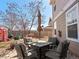 Back patio with comfortable seating and sun umbrella at 896 Willow Dr, Brighton, CO 80603
