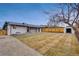 Spacious backyard with new sod, wood fence, and storage shed at 1061 Elbert St, Denver, CO 80221