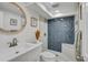 Modern basement bathroom with herringbone tile shower at 1061 Elbert St, Denver, CO 80221