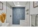 Basement bathroom with walk-in shower and bench at 1061 Elbert St, Denver, CO 80221