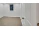 Bright basement bedroom with carpet, window, and closet at 1061 Elbert St, Denver, CO 80221