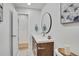 Modern bathroom with a sleek vanity and a large mirror at 1061 Elbert St, Denver, CO 80221