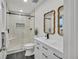 Spa-like bathroom with double vanity and walk-in shower at 1061 Elbert St, Denver, CO 80221