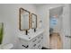 Bathroom with double vanity and access to bedroom at 1061 Elbert St, Denver, CO 80221