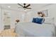 Main bedroom with ensuite bathroom and ceiling fan at 1061 Elbert St, Denver, CO 80221