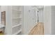 Bright hallway with built-in shelves and light wood flooring at 1061 Elbert St, Denver, CO 80221